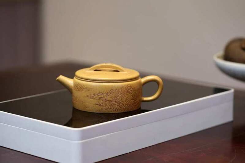 Yellow stalks, green sprouts, blue sky, dropping hillside